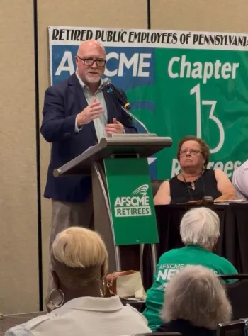 AFSCME President Patrick Moran speaks to retirees as International Executive Board Retiree Representative Jeanne Weaver looks on